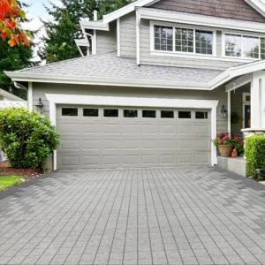 Image of a home with a beautiful Holland Lox interlocking paver driveway.