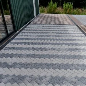 Patio area made with Orange Pavers' Holland Lux concrete interlocking pavers.